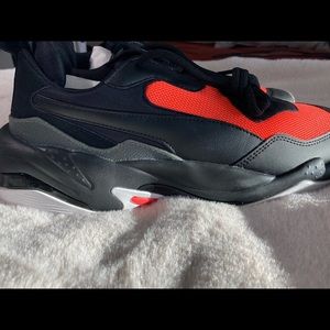Size 10 puma grey orange black trainers , extremely comfortable ! Never worn